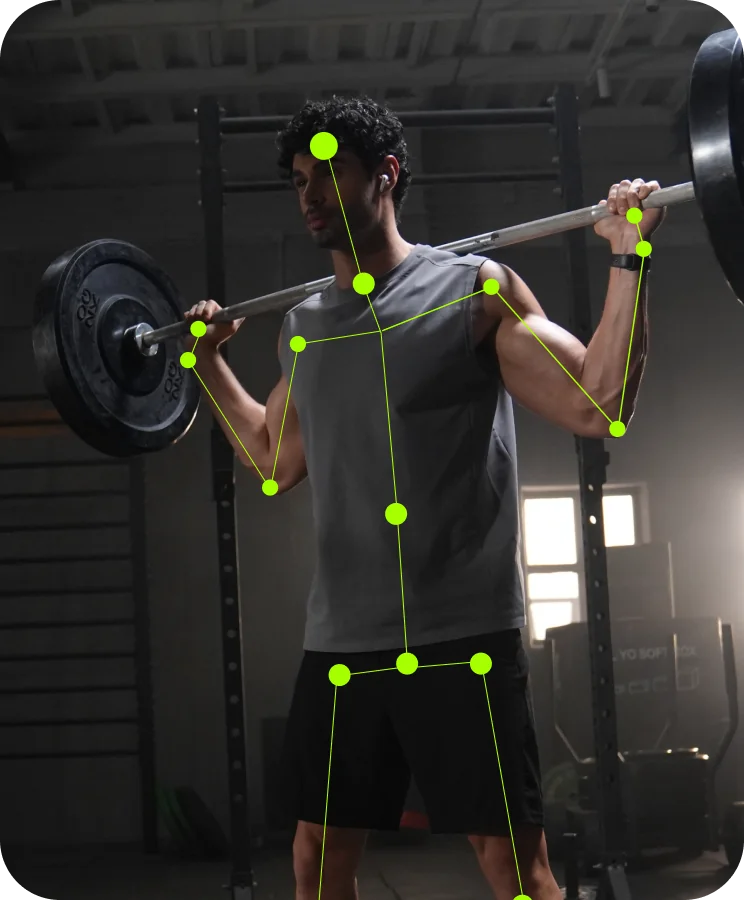 Person squatting with skeletal tracking overlay